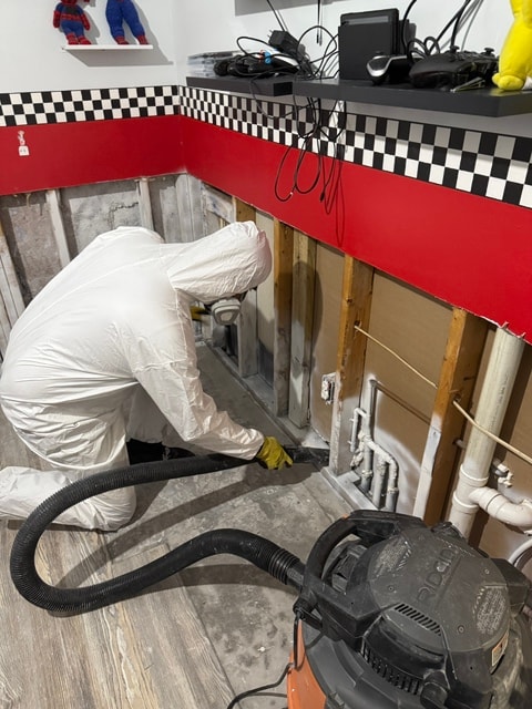 RBI 7 Group technician performing water damage mitigation